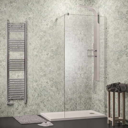 Modern walk-in shower with glass screen, rainfall shower panel, towel rail, and stone-effect walls