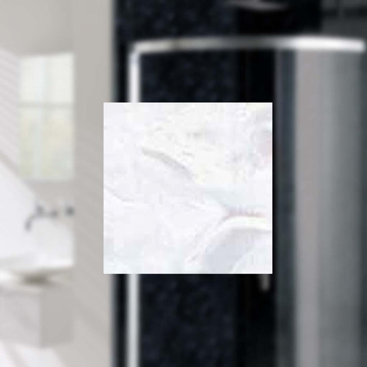 Modern bathroom with glass shower enclosure and wall-mounted sink
