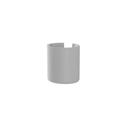 Modern cylindrical basin bottle trap cover in matte grey finish for bathroom sinks
