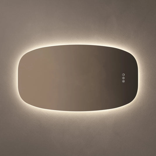 Rectangular bathroom mirror with rounded edges and LED backlit lighting on a neutral wall