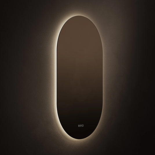 Oval bathroom mirror with LED backlighting on a dark wall