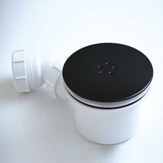 Black and white shower waste trap with round cover, modern bathroom plumbing accessory