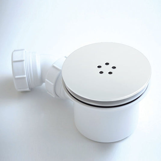 White shower waste trap with circular cover and side outlet for bathroom drainage