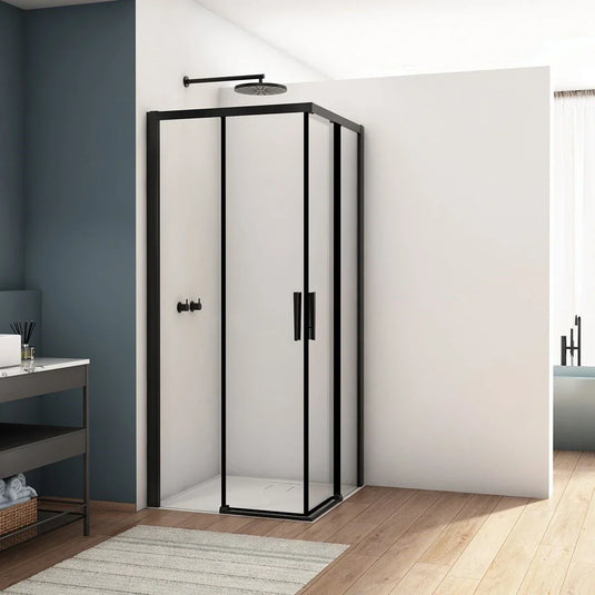 Modern bathroom with black-framed glass shower enclosure and overhead rainfall shower