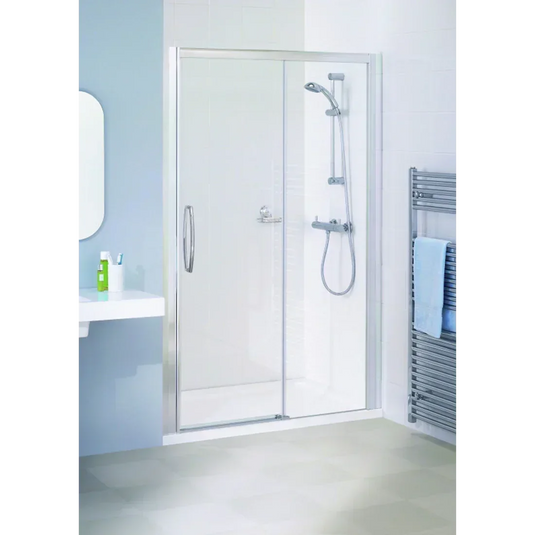 Modern bathroom with glass shower enclosure, chrome rainfall shower, and towel radiator